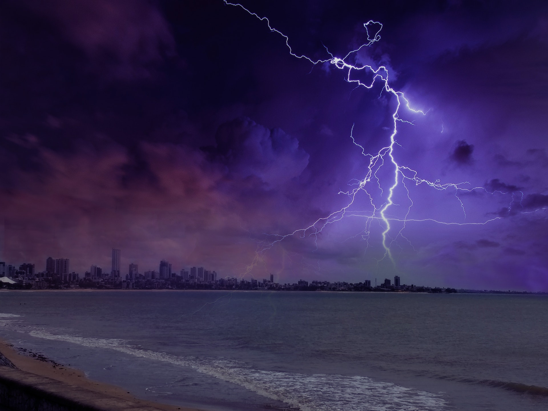 Lightning Phenomenon Near City and Ocean